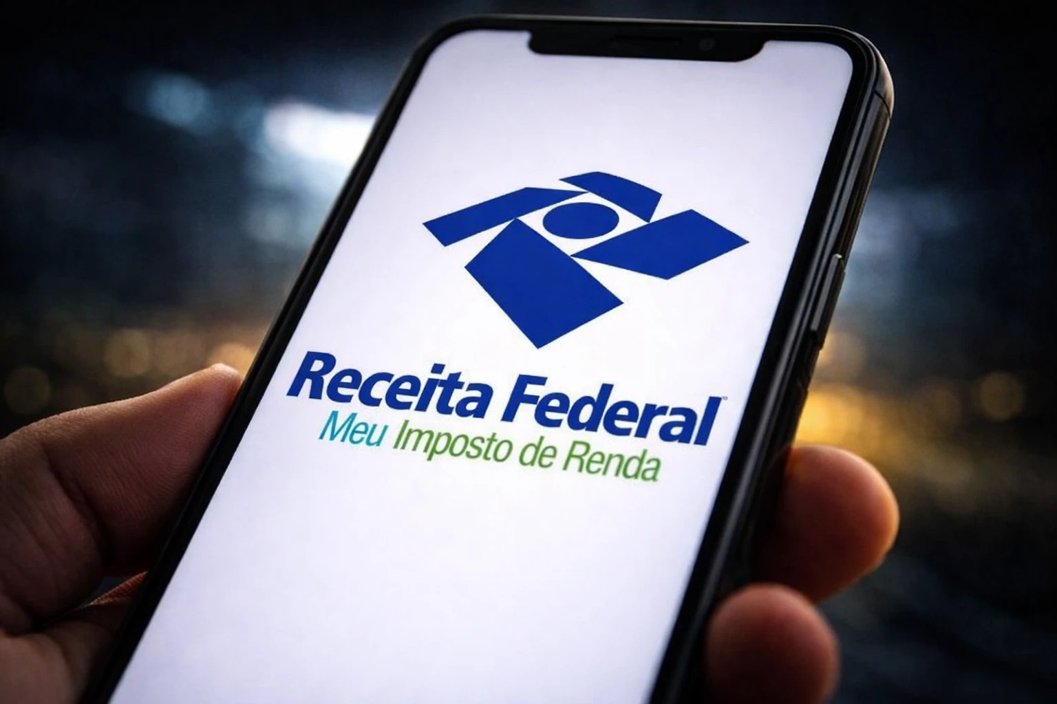 Celular Exibindo O Aplicativo Meu Imposto De Renda Da Receita Federal Na Tela, Representando O Prazo Para Envio Do Ir 2026.