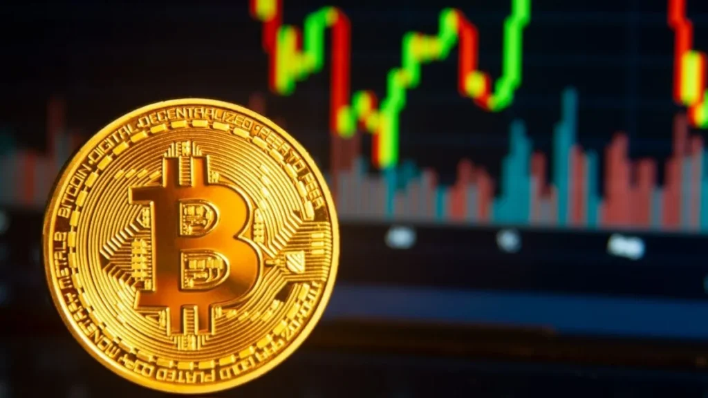 Bitcoin Mira Vencimento Bilionário De Opções E Mercado Vê Faixa Decisiva Para O Preço Até 29 De Maio 2 Moeda De Bitcoin Em Destaque Diante De Gráfico Financeiro Com Fortes Oscilações De Alta E Baixa Durante Semana Decisiva Para O Mercado De Criptomoedas.