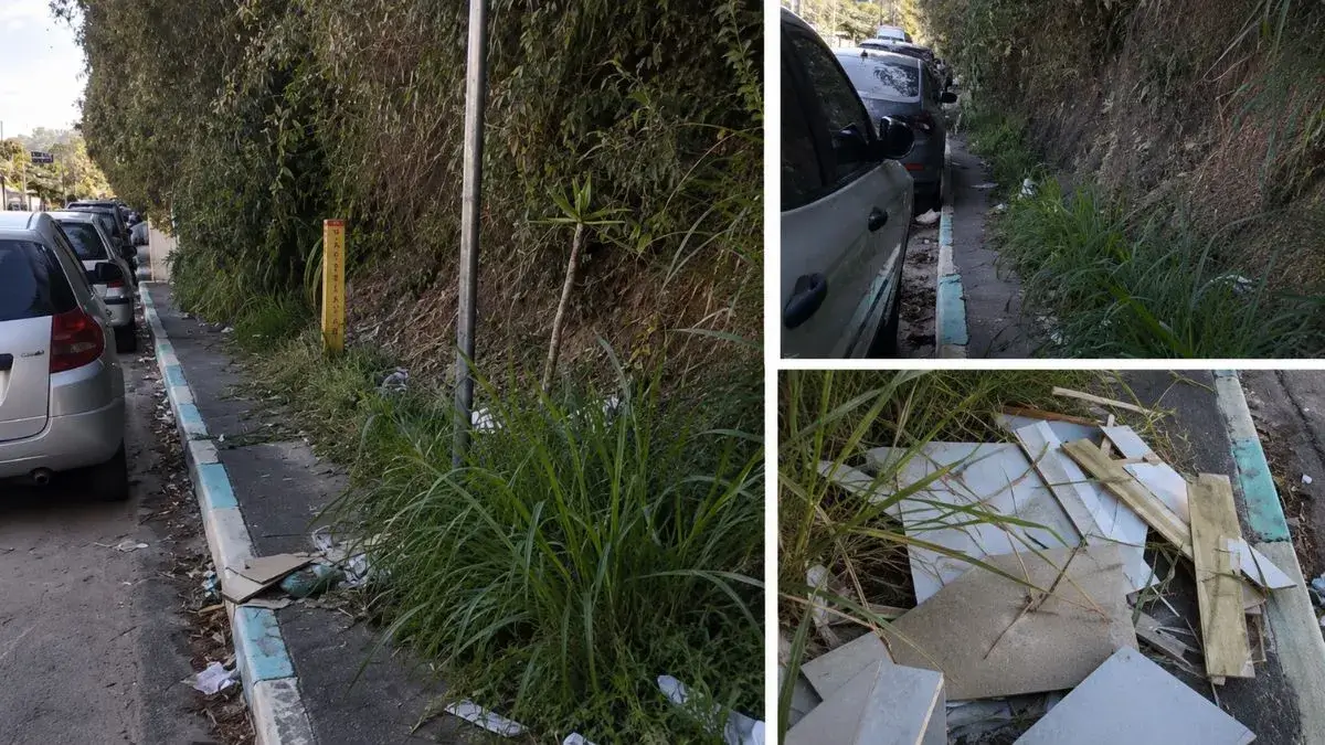 Calçada estreita tomada por mato, lixo e entulho na Avenida Vereador Gonzaga D’Ávila, em Caieiras.